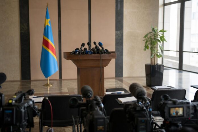 Minister of Health Roger Kamba speaking at a press conference about Ebola visa restrictions