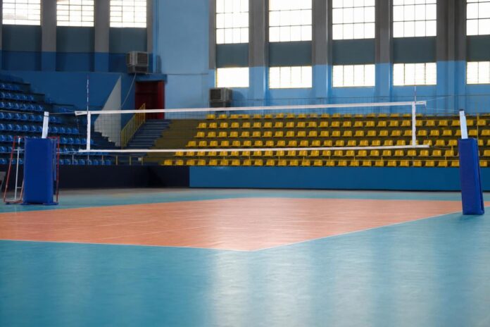 Joueurs de volley-ball célébrant un point au Complexe Sportif Stade Père Raphaël de la Kethule