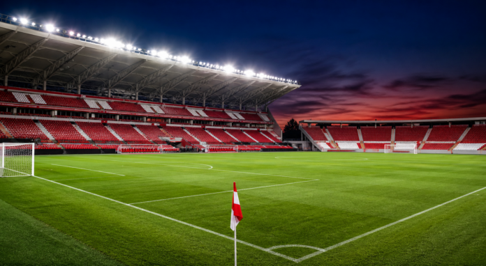 Illustration editoriale d un stade espagnol rouge et blanc apres la victoire 3-0 d Almeria contre Eldense.