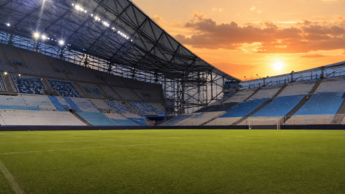 Illustration editoriale d un grand stade mediterraneen apres la victoire de Marseille contre l Athletic Club.